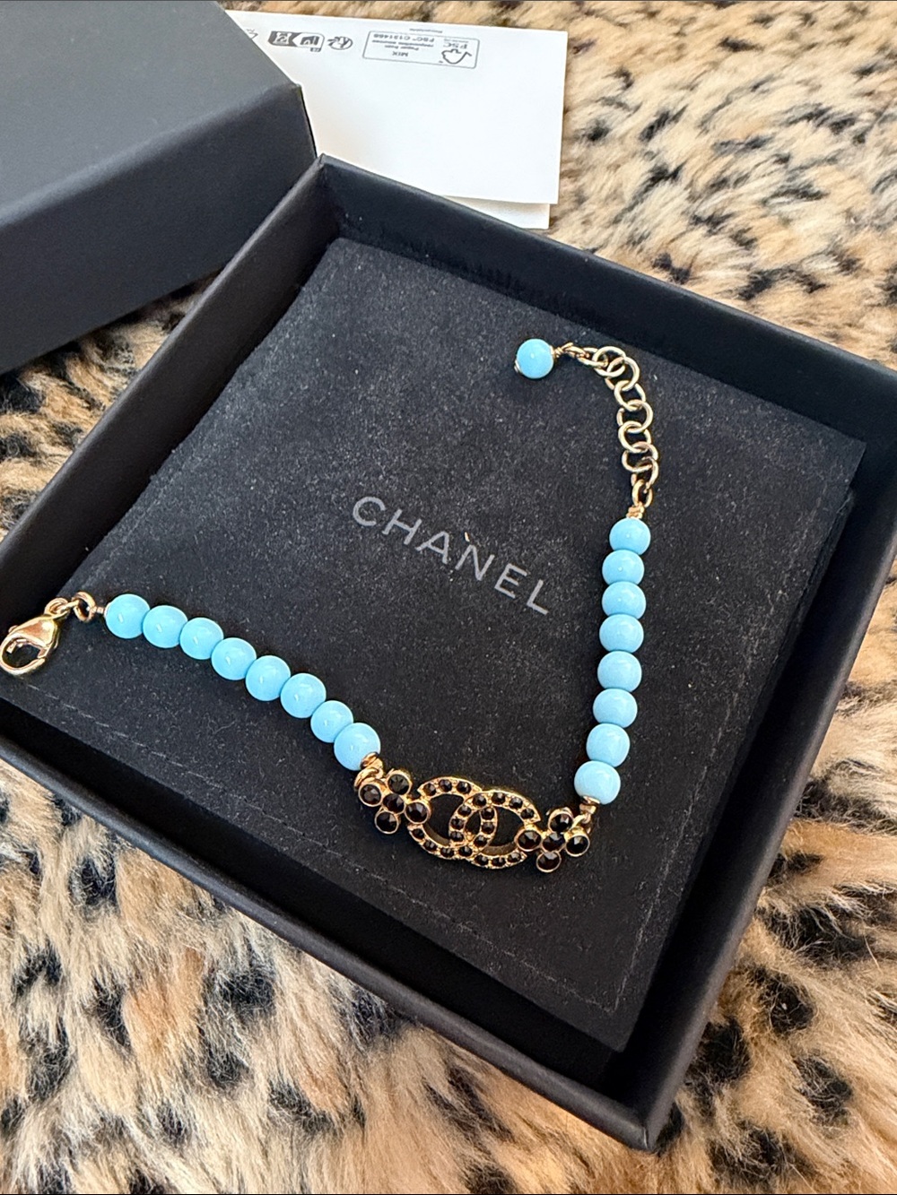 CHANEL Gold-Tone Bracelet with Light Blue Beads and Logo Charm - Picture 5 of 5